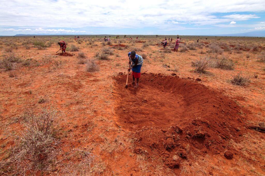 Man digging water bund